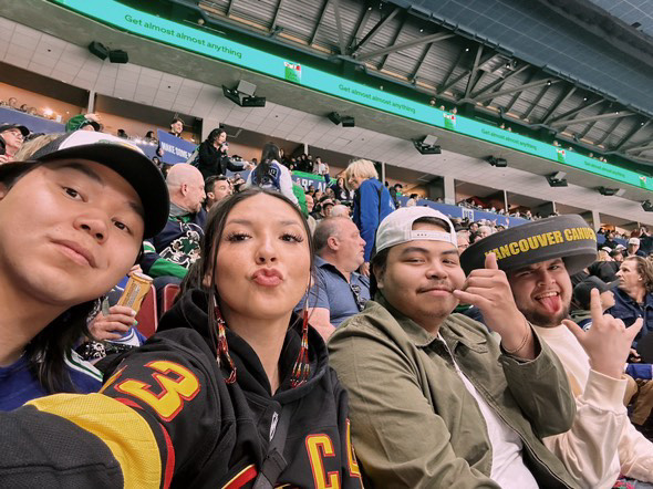 UBC exchange student Aidan Downey with friends at a Canucks game